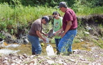 Researchers at Aaniiih Nakoda College look for signs of life in a stream tainted with heavy metals.